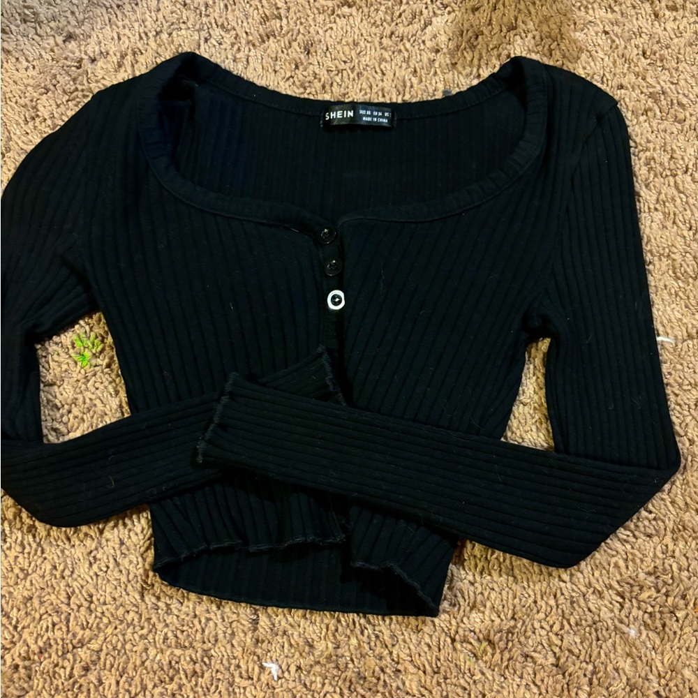 I am selling a black women’s extra small crop top from SHEIN